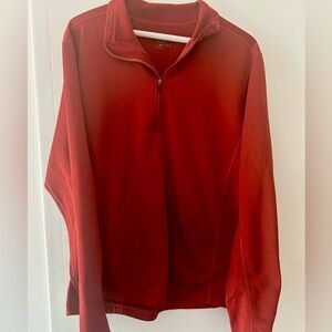 REI quarter zip with light fleece lining, rich orange color
